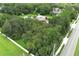 Aerial view showing property with large lot, outbuildings, and mature trees at 2341 Celery Ave, Sanford, FL 32771