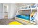 Bunk bed bedroom with Minion theme and adjacent bathroom at 7525 Sunflower Cir, Kissimmee, FL 34747