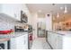 Modern kitchen with white cabinets and granite countertops at 7525 Sunflower Cir, Kissimmee, FL 34747