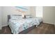 Bedroom with two twin beds, beach themed bedding, and large window at 7525 Sunflower Cir, Kissimmee, FL 34747