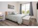 Bright bedroom with a queen bed, large window, and ample natural light at 7525 Sunflower Cir, Kissimmee, FL 34747