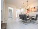 Elegant dining area and view of entryway and bathroom at 7525 Sunflower Cir, Kissimmee, FL 34747