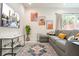 Cozy living room featuring a gray sectional sofa and patterned rug at 7525 Sunflower Cir, Kissimmee, FL 34747