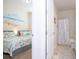 Bathroom with shower/tub combo and adjacent bedroom view at 7525 Sunflower Cir, Kissimmee, FL 34747