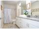 Bathroom with double vanity and granite countertops at 7525 Sunflower Cir, Kissimmee, FL 34747