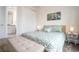 Light and airy bedroom with a queen bed and an ensuite bathroom at 7525 Sunflower Cir, Kissimmee, FL 34747
