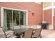 Relaxing patio features a table, chairs, and sliding glass door access at 7525 Sunflower Cir, Kissimmee, FL 34747