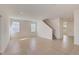 Spacious living area with tile floors and stairs at 33239 Country House Dr, Sorrento, FL 32776