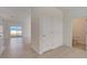 Foyer with tile floors and half bathroom at 33239 Country House Dr, Sorrento, FL 32776