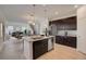 Modern kitchen with large island and stainless steel appliances at 33239 Country House Dr, Sorrento, FL 32776