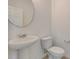 Small bathroom with pedestal sink and toilet at 33239 Country House Dr, Sorrento, FL 32776