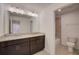Bathroom boasts a double vanity and a separate tub and toilet area at 33239 Country House Dr, Sorrento, FL 32776