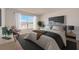 Relaxing bedroom with a king-size bed and large window at 33239 Country House Dr, Sorrento, FL 32776