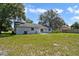 Spacious backyard with a large grassy area at 342 W De Carlo Dr, Deltona, FL 32725