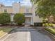 Front entrance of a townhome with landscaping and parking at 7502 Seven Eagles Way, Reunion, FL 34747