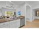 Kitchen with granite countertops, stainless steel appliances, and breakfast bar at 7502 Seven Eagles Way, Reunion, FL 34747