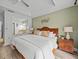 King-size bed in a spacious main bedroom with ensuite access at 7502 Seven Eagles Way, Reunion, FL 34747