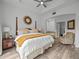 Main bedroom with king-size bed, en-suite bathroom, and sitting area at 7502 Seven Eagles Way, Reunion, FL 34747