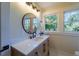 Elegant bathroom with a single vanity and large window at 17 N Shine Ave, Orlando, FL 32801