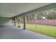 Screened porch overlooking grassy backyard at 1042 Twisted Branch Ln, St Cloud, FL 34771