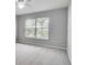 Bright bedroom with ceiling fan and large window at 1042 Twisted Branch Ln, St Cloud, FL 34771