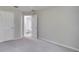 Bedroom with carpet flooring, an ensuite bathroom, and a walk-in closet at 1042 Twisted Branch Ln, St Cloud, FL 34771