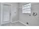 Laundry room with exterior access and shelving at 1042 Twisted Branch Ln, St Cloud, FL 34771