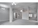 Spacious living room with high ceilings, ceiling fan and an open floor plan at 1042 Twisted Branch Ln, St Cloud, FL 34771