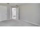 Bedroom with carpet flooring, an ensuite bathroom, and a walk-in closet at 1042 Twisted Branch Ln, St Cloud, FL 34771