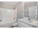 Clean bathroom with white vanity, toilet and bathtub at 1042 Twisted Branch Ln, St Cloud, FL 34771