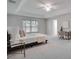 Large primary bedroom with carpeted floors, a ceiling fan, and plenty of natural light at 1042 Twisted Branch Ln, St Cloud, FL 34771
