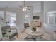 Open living area with views into kitchen and entryway at 1042 Twisted Branch Ln, St Cloud, FL 34771
