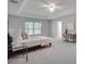 Spacious primary bedroom with an en-suite bathroom and a large window at 1042 Twisted Branch Ln, St Cloud, FL 34771