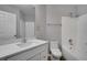 Clean bathroom with white vanity, toilet and bathtub at 1042 Twisted Branch Ln, St Cloud, FL 34771
