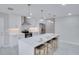 Newly renovated kitchen boasts white cabinets, a center island, and stainless steel appliances at 1042 Twisted Branch Ln, St Cloud, FL 34771