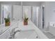Double vanity bathroom with modern fixtures and a large soaking tub at 1042 Twisted Branch Ln, St Cloud, FL 34771