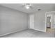 Bedroom with carpet, ceiling fan, and ensuite bathroom access at 1042 Twisted Branch Ln, St Cloud, FL 34771