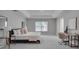 Bright Primary bedroom with a king bed, workspace, and ample closet space at 1042 Twisted Branch Ln, St Cloud, FL 34771