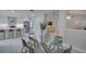 Open concept dining area with a view into the kitchen at 1042 Twisted Branch Ln, St Cloud, FL 34771