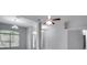 Open concept living room with a view of the kitchen and entryway at 1042 Twisted Branch Ln, St Cloud, FL 34771