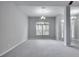 Bright dining room with large window and neutral color palette at 1042 Twisted Branch Ln, St Cloud, FL 34771