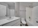 Clean bathroom with white vanity, toilet and bathtub at 1042 Twisted Branch Ln, St Cloud, FL 34771