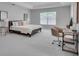 Spacious Primary bedroom with a desk area and plenty of room for a king-size bed at 1042 Twisted Branch Ln, St Cloud, FL 34771