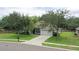 House exterior with driveway and landscaping at 1042 Twisted Branch Ln, St Cloud, FL 34771