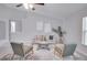 Cozy living room with comfy seating, a neutral color palette, and plenty of natural light at 1042 Twisted Branch Ln, St Cloud, FL 34771