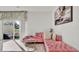 Bright living room featuring a pink sectional sofa and sliding glass doors leading to a patio at 3663 Circle Hook St, Kissimmee, FL 34746
