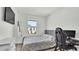 Bright bedroom with a gaming setup and window at 3663 Circle Hook St, Kissimmee, FL 34746