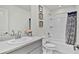 Guest bathroom with tub shower combo and gray vanity at 3663 Circle Hook St, Kissimmee, FL 34746