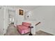 Upstairs hallway with a pink tufted bench and carpet at 3663 Circle Hook St, Kissimmee, FL 34746