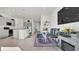 Open concept dining area with a modern table and chairs, near the kitchen at 3663 Circle Hook St, Kissimmee, FL 34746